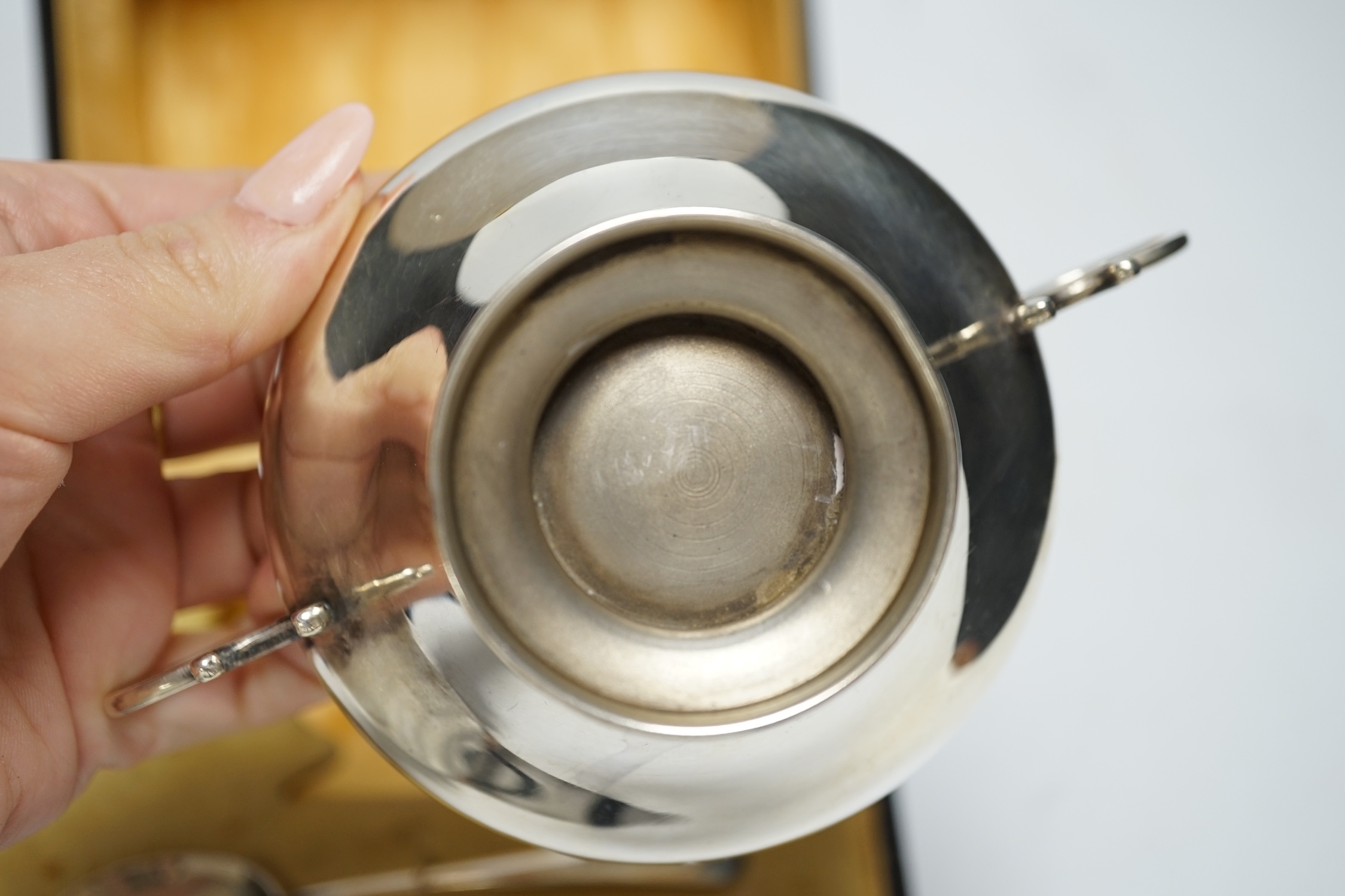 A George V cased silver christening bowl and spoon, Joseph Gloster Ltd, Birmingham, 1928/29, bowl diameter 92mm.